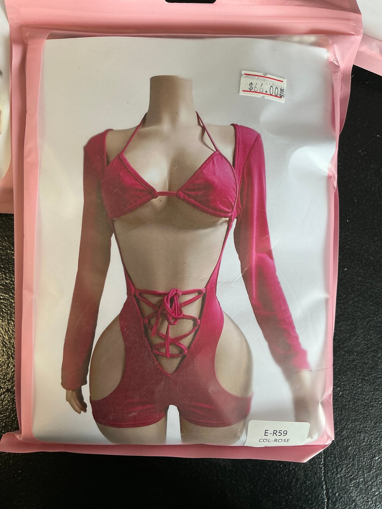 Long sleeve, open front romper with tight up front bikini and top