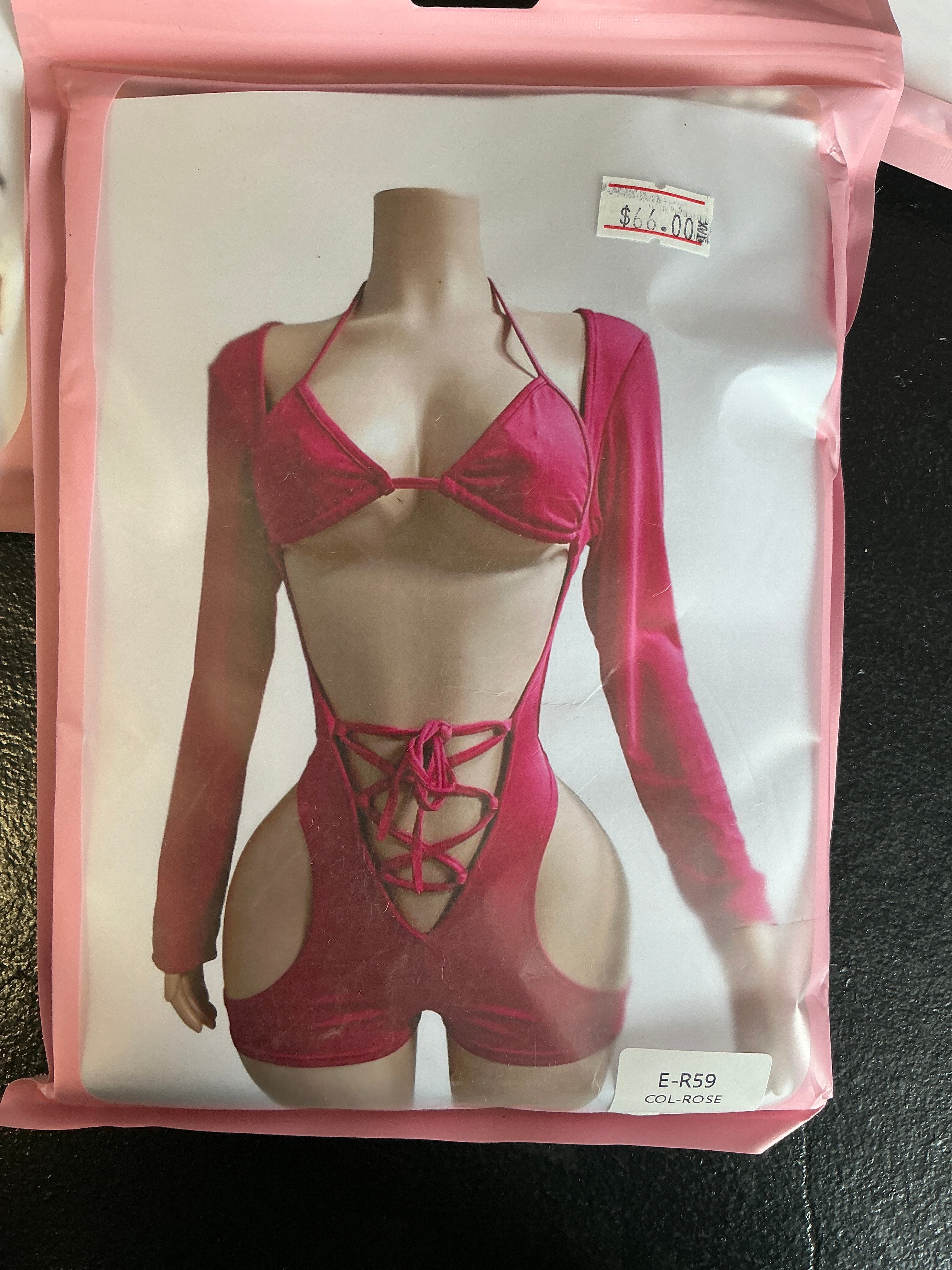 Long sleeve, open front romper with tight up front bikini and top