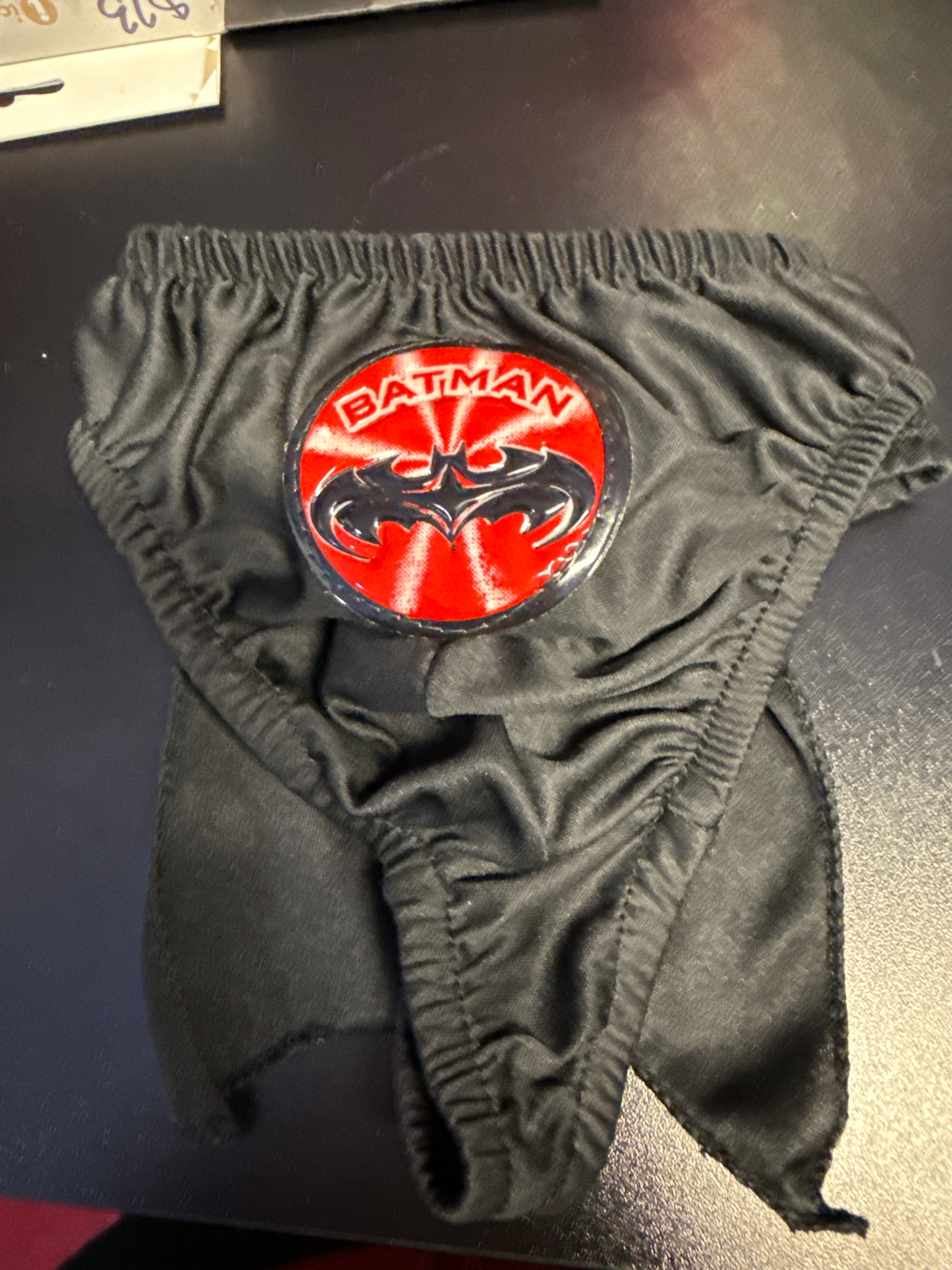 men's Batman thong or bikini-style underwear with an attached or integrated cape